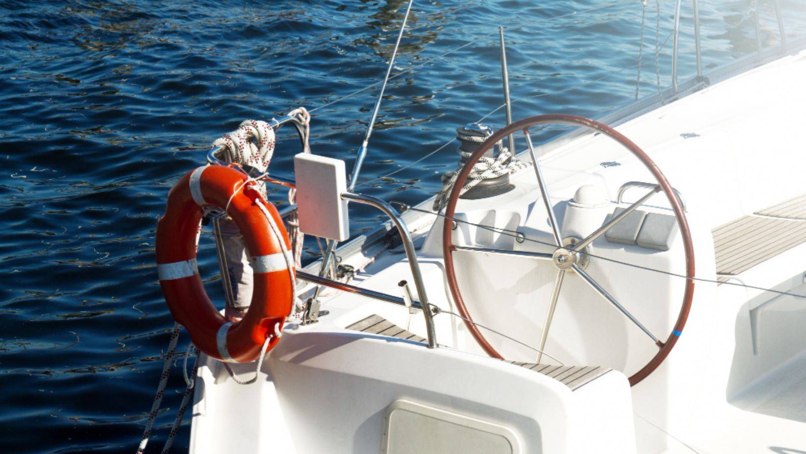 Biscayne Bay Tragedy sailing safety—lifebuoy and helm on a sailboat near Miami Beach highlighting boating safety