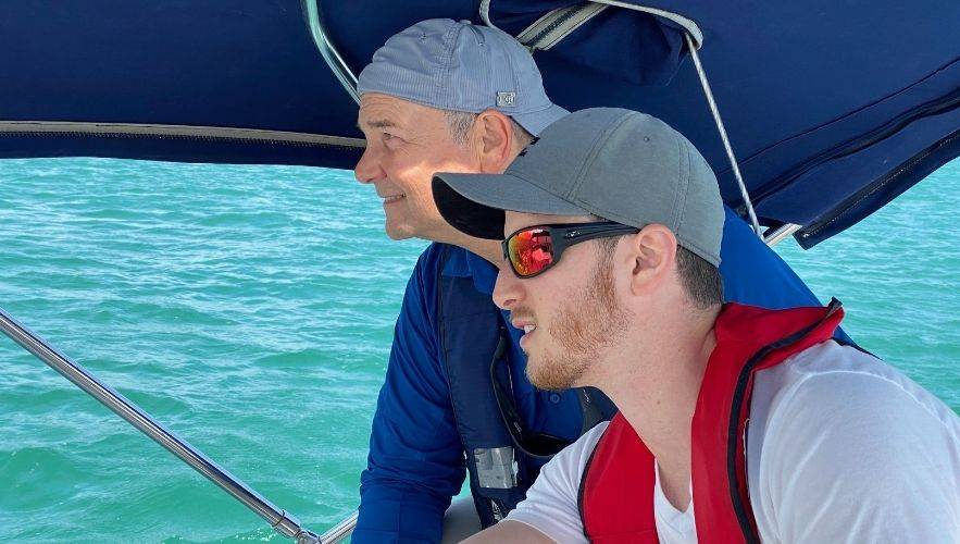 Sailing in Storm SeasonInstructor teaching storm safety and seamanship skills on a sailboat — Miami Sailing School ™ training for storm season. .