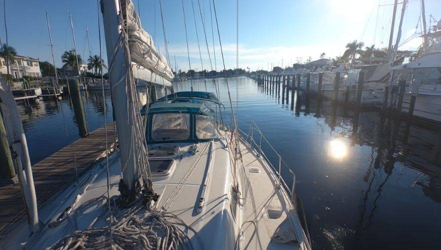 Sailboat secured at the dock demonstrating essential docking and mooring techniques every sailor should master.