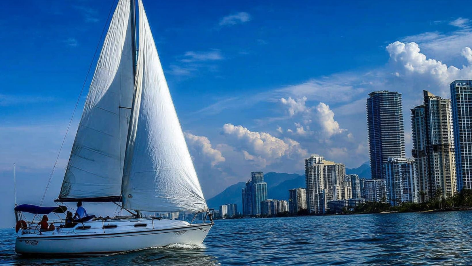 Biscayne Bay sailing with sailboat near Miami skyline during sailing lessons Miami