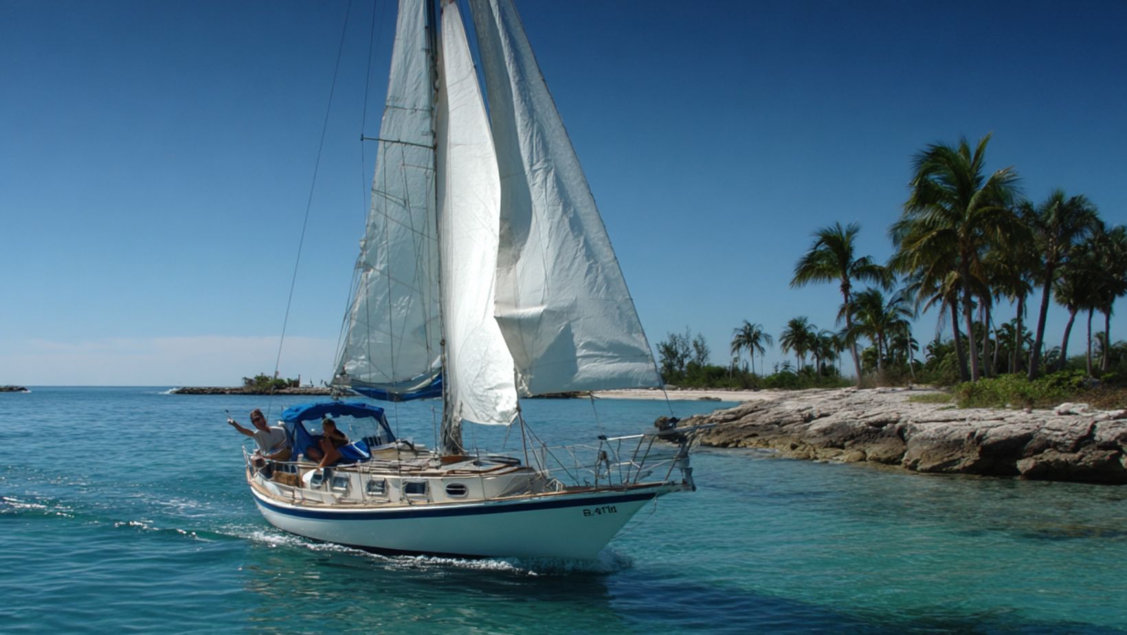 Biscayne Bay sailing near tropical shoreline during sailing lessons Miami